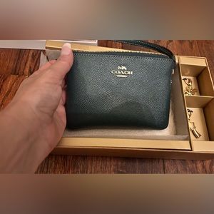 Coach wristlet new w charms brand new in box !